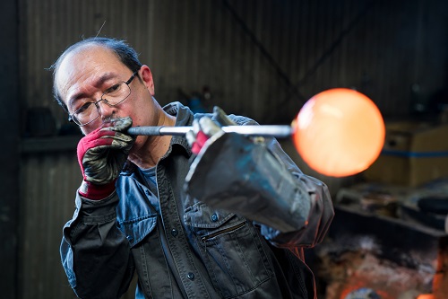 Man glass blowing