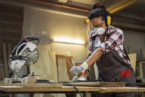 Woman sanding wood